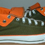 Foldover High Top Chucks  Outside views of olive green and orange foldovers rolled down to the sixth eyelet.