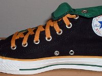 Foldover High Top Chucks Gallery 4  Inside patch view of a right black, green, and amber high top rolled down to the seventh eyelet.