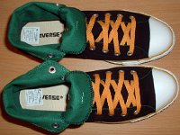 Foldover High Top Chucks Gallery 4  Top view of black, green, and amber high tops rolled down to the seventh eyelet.