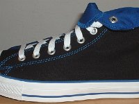 Foldover High Top Chucks Gallery 4  Outside view of a left black and royal blue high top rolled down to the seventh eyelet.