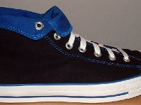Foldover High Top Chucks Gallery 4  Outside view of a right black and royal blue high top rolled down to the seventh eyelet.