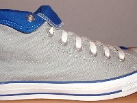 Foldover High Top Chucks Gallery 4  Outside view of a right light grey and royal blue high top rolled down to the seventh eyelet.