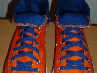 Foldover High Top Chucks Gallery 4  Angled front and top view of orange and royal blue high tops rolled down to the seventh eyelet.
