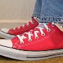 Foldover Double Upper High Top Chucks  Wearing folded down red foldover double upper high top chucks with blue jeans, left side view.
