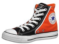 Chucks with Geometric Pattern Uppers  Angled inside patch view of a right black and orange high top.