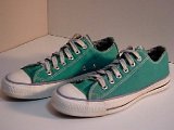 Green Low Cut (Oxford) Chucks  Angled side view of turquoise low cut chucks.