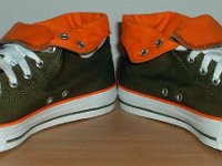 Green and Orange Foldover High Top Chucks  Angled front view of olive green and orange foldovers rolled down to the sixth eyelet.