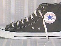 Grey Chucks  Right charcoal grey high top, inside patch view.