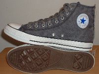 Grey Chucks  Inside patch and sole views of distressed black high tops.