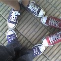 Group Shots of Chucks  Triangle of navy blue, purple, and red high top chucks.