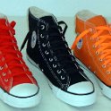 Group Shots of Chucks  Red, black, and orange high tops with red, black and neon orange laces.