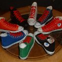 Group Shots of Chucks  Core and seasonal high top chucks with red retro shoelaces, shot 1.