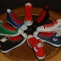 Group Shots of Chucks  Core and seasonal high top chucks with red retro shoelaces, shot 2.