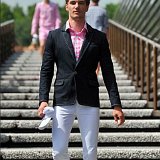 Guys Wearing Optical White Chucks  Wearing optical white chucks with a navy blue blazer, pink and white shirt, and white pants.