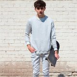 Guys Wearing Optical White Chucks  Wearing optical white high tops with rolled up chinos, a grey pullover, and white tee shirt.