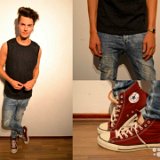 Guys Wearing Red Chucks  Guy wearing maroon high top chucks with a black muscle shirt and faded blue jeans.