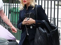 Gwen Stefani  Gwen Stefani getting ready to go on a trip wearing black low top chucks.
