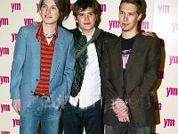 Hanson  Posed shot of the band, with Taylor and Zac wearing black chucks.