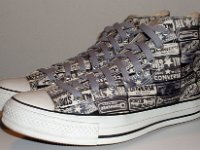 Heel Patch Print High Top Chucks  Angled side view of black and white heel patch print high tops with gray shoelaces.