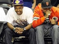 Hip-Hop musicians wearing chucks.  Omarion and Chris Brown wear black and green chucks