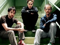 Hoobastank  Sitting on some stairs. Doug Robb is wearing red high top chucks.