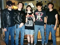 The Huntingtons  Band members with a fan also wearing black high top chucks.