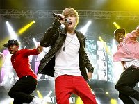 Justin Bieber  Justin Bieber performing in black high top chucks.