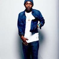 Kendrick Lamar  Kendrick rocks white chucks against an all white background.