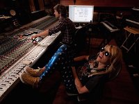 Kesha  In the studio wearing natural white high top chucks