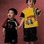 Ads With Little Kids Wearing Chucks  Young boy wearing black low cut chucks.