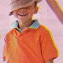 Ads With Little Kids Wearing Chucks  A young boy in an orange shirt wears black chucks.