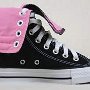Knee High Chucks  Outside view of a right black and pink kneehi folded down.