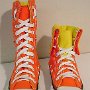 Knee High Chucks  Orange and yellow knee highs, front view of right shoe full height and left shoe folded down.