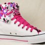 Knee High Chucks  Folded down right white and floral pattern knee high with neon pink laces.