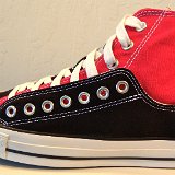 Layer Up High-Low Chucks  Outside view of a left black and red layer up high top.