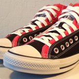 Layer Up High-Low Chucks  Angled side view of black and red layer up high tops with white shoelaces.