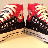 Layer Up High-Low Chucks  Angled front view of black and red layer up high tops with white shoelaces.