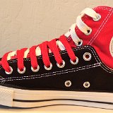 Layer Up High-Low Chucks  Inside patch view of a right black and red layer up high top with red and white shoelaces.