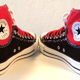 Layer Up High-Low Chucks  Angled rear view of black and red layer up high tops with red and white shoelaces.