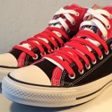 Layer Up High-Low Chucks  Angled side view of black and red layer up high tops with red and white shoelaces.