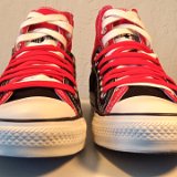 Layer Up High-Low Chucks  Front view of black and red layer up high tops with red and white shoelaces.