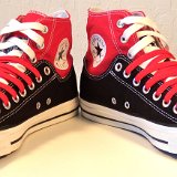 Layer Up High-Low Chucks  Angled front view of black and red layer up high tops with red and white shoelaces.