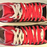 Layer Up High-Low Chucks  Top view of black and red layer up high tops with red and white shoelaces.