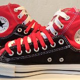 Layer Up High-Low Chucks  Inside patch views of black and red layer up high tops with red and white shoelaces.