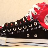 Layer Up High-Low Chucks  Inside patch view of a right black and red layer up high top with black and white shoelaces.