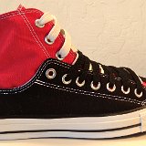 Layer Up High-Low Chucks  Outside view of a right black and red layer up high top with white and black shoelaces.