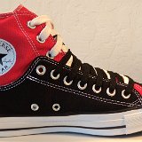 Layer Up High-Low Chucks  nside patch view of a left black and red layer up high top with black and white shoelaces.