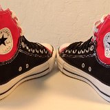 Layer Up High-Low Chucks  Angled rear view of black and red layer up high tops with black and white shoelaces.