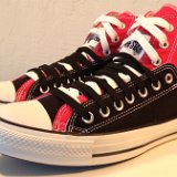Layer Up High-Low Chucks  Angled side view of black and red layer up high tops with black and white shoelaces.