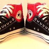 Layer Up High-Low Chucks  Angled front view of black and red layer up high tops with black and white shoelaces.